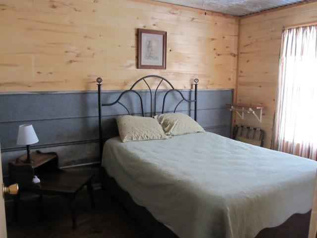 Cabin 5 (2 Bedroom) 1 King size bed, 1 Queen size bed, 1 Full size futon, 5 twin beds, sleeps up to 10.