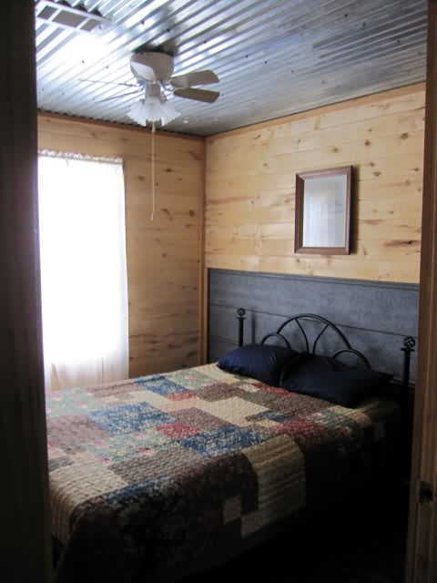 Cabin 5 (2 Bedroom) 1 King size bed, 1 Queen size bed, 1 Full size futon, 5 twin beds, sleeps up to 10.